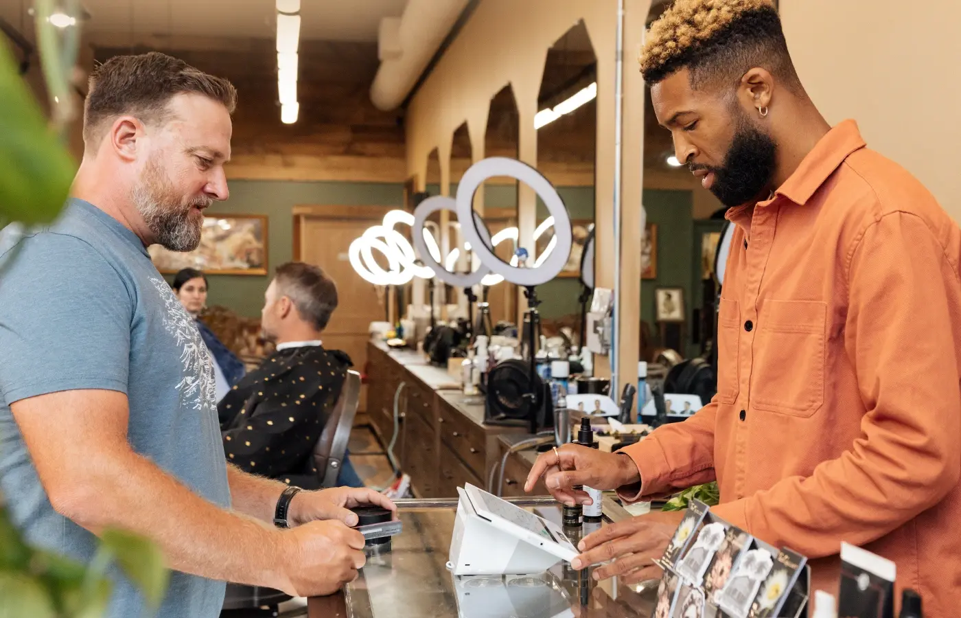 Clover Mini set up at a barbershop service counter